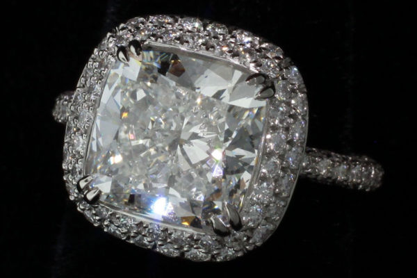 Diamond ring surrounded by melee diamonds.